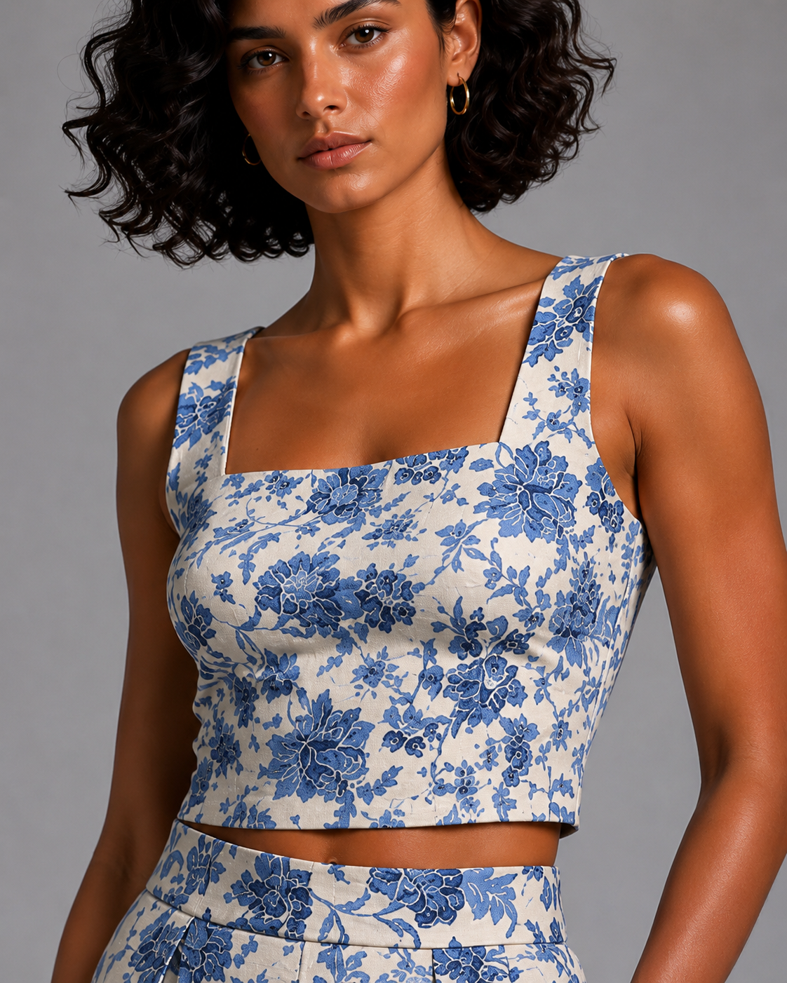 Blue floral set featuring a sleeveless crop top and a midi skirt.