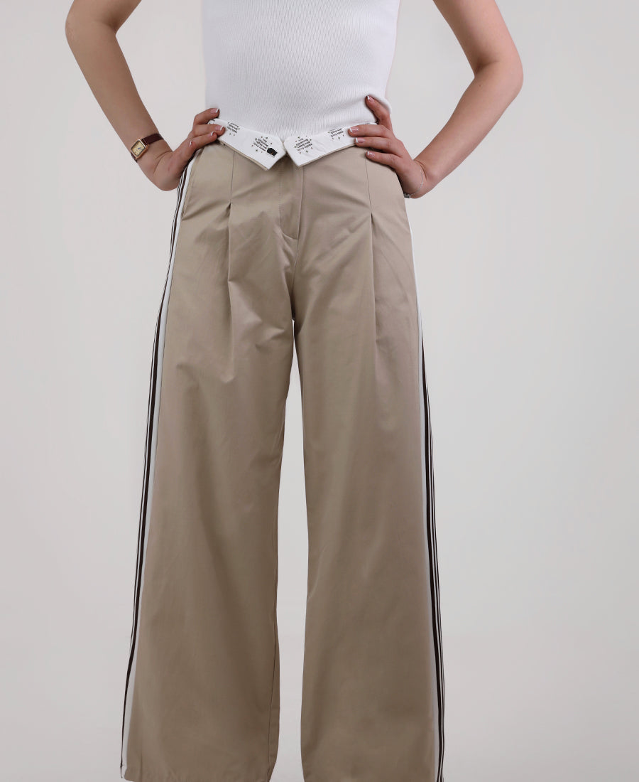 Beige trousers with black stripes on the sides