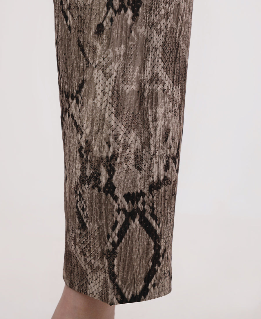 High-waisted snakeskin pants with a belt