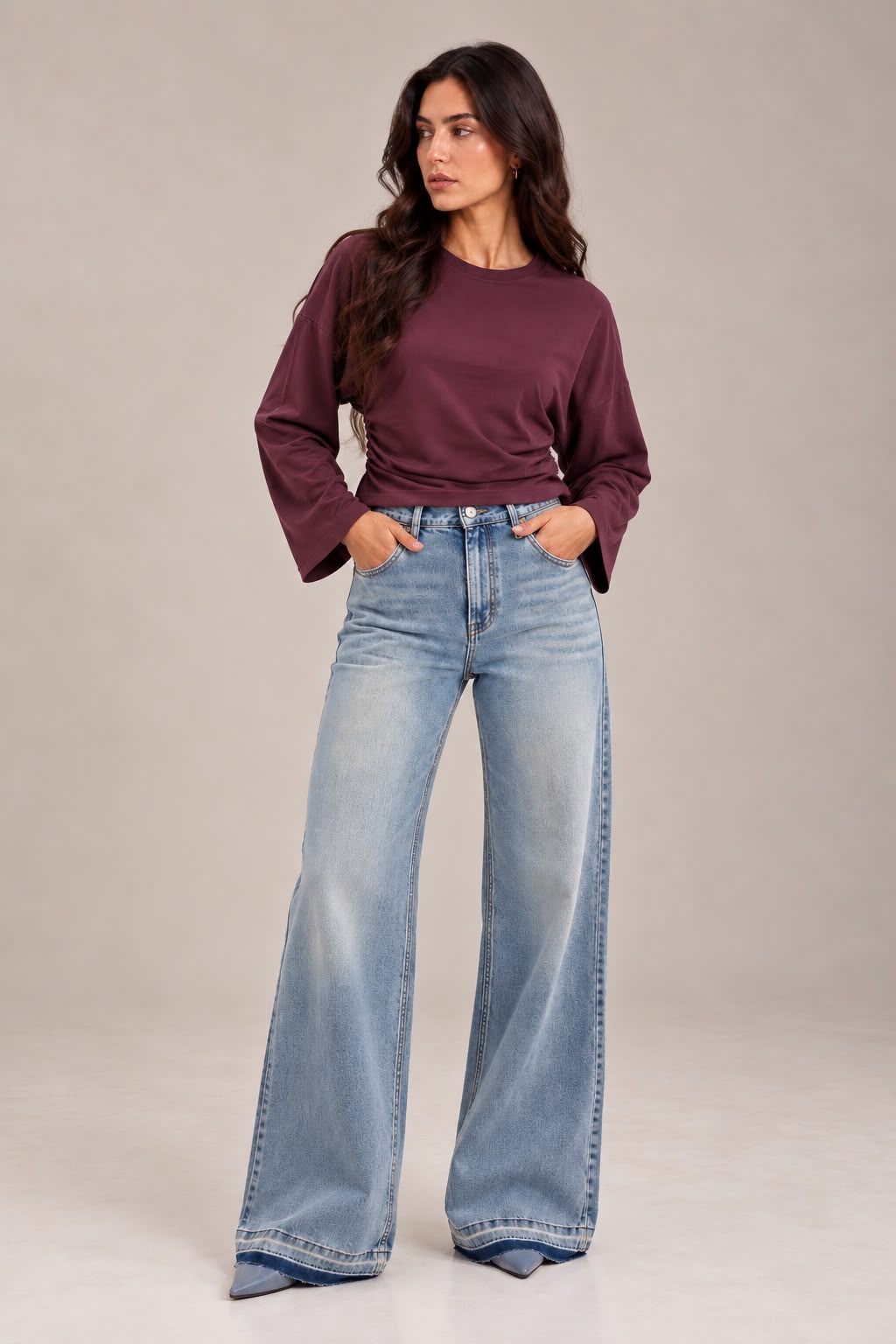 Sky blue flare jeans with a darker gradient at the bottom of the leg