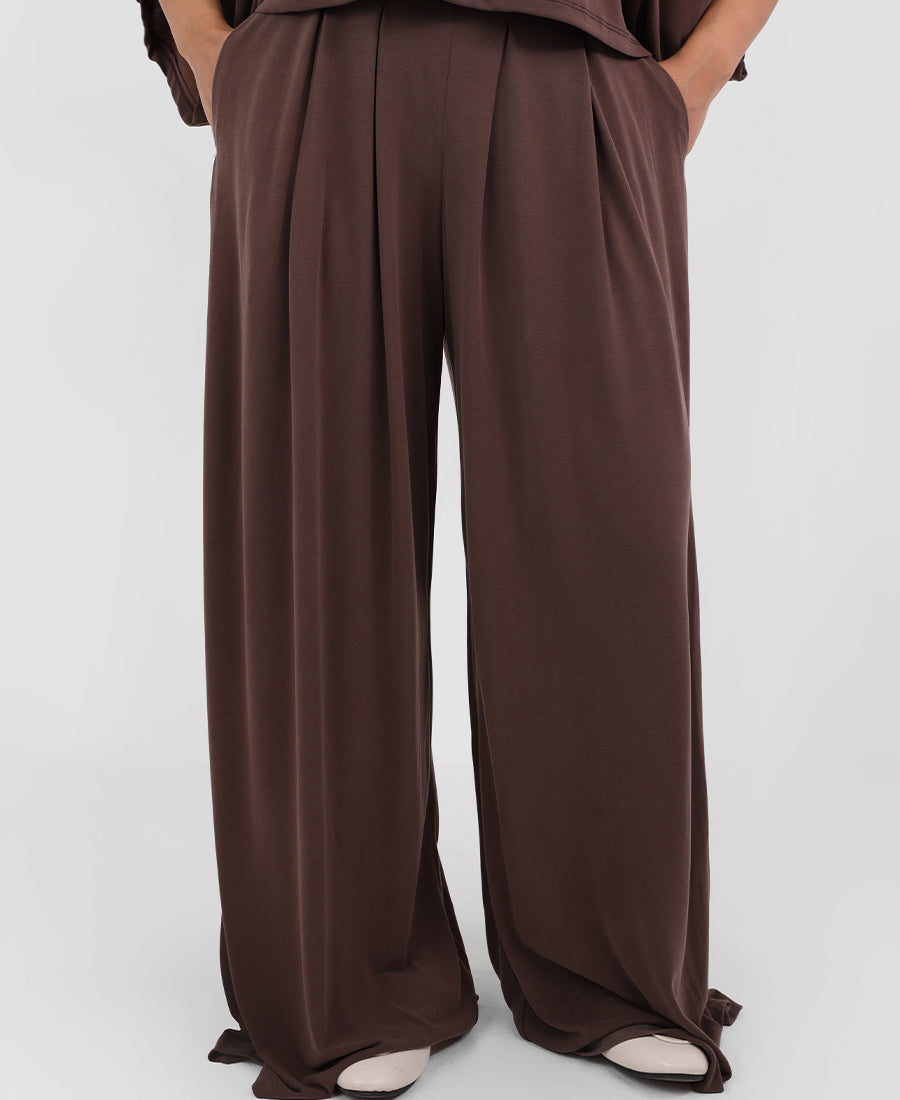 Wide leg trousers with an elasticated pleated waist