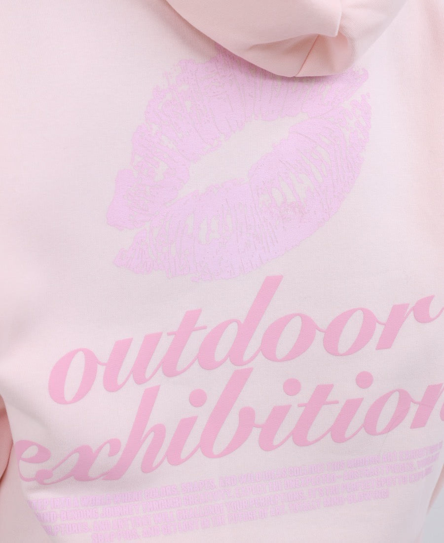 Strawberry hoodie with a kiss-themed message.