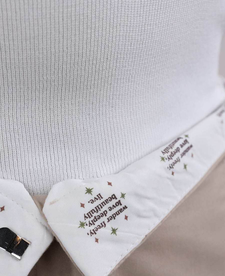 Beige trousers with black stripes on the sides