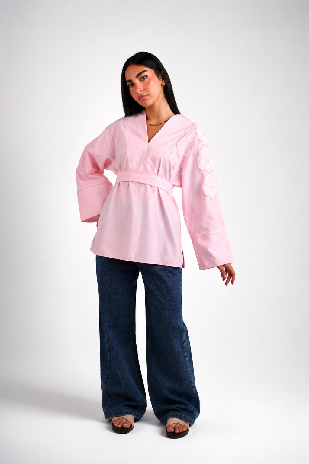 V-neck blouse adorned with shimmering roses, tie waist