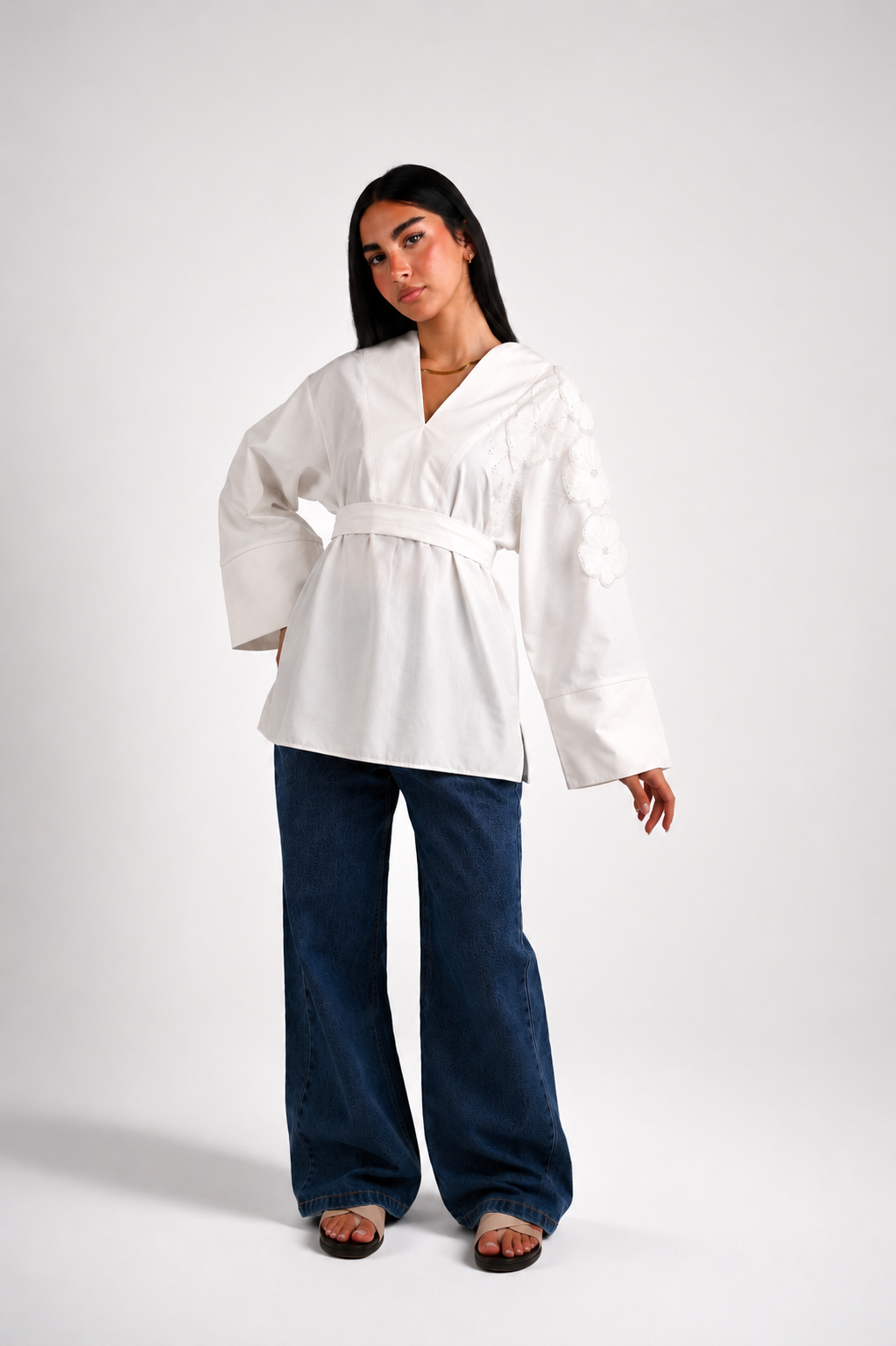 V-neck blouse adorned with shimmering roses, tie waist
