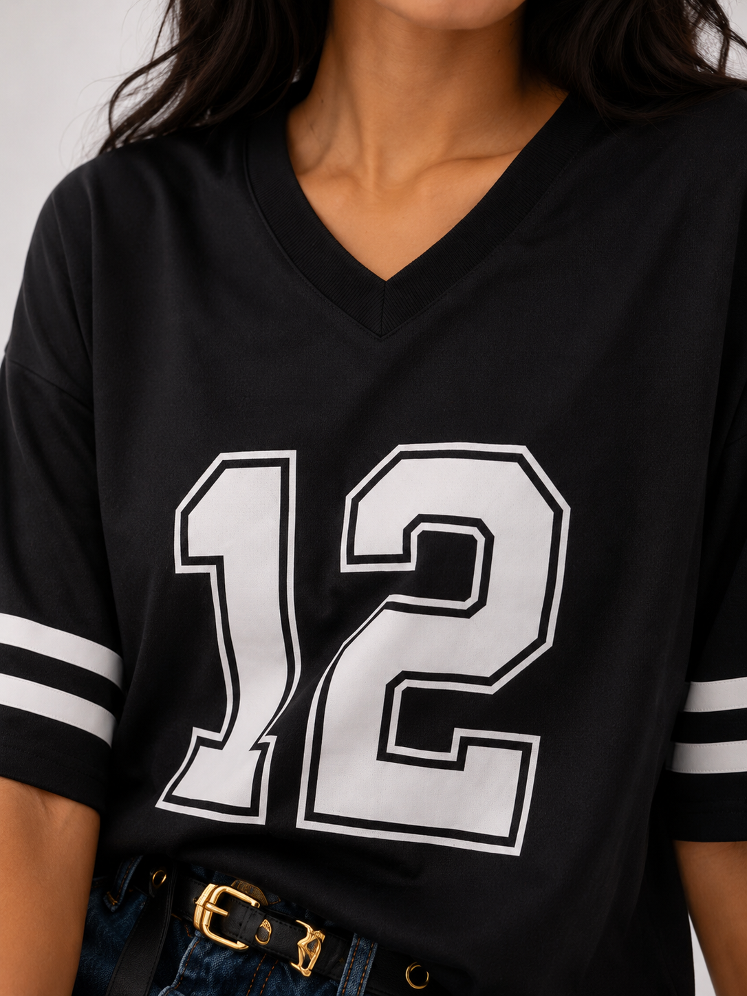 Oversized T-shirt with a print on the front bearing "the number 12", and on the back the phrase "We are 12".