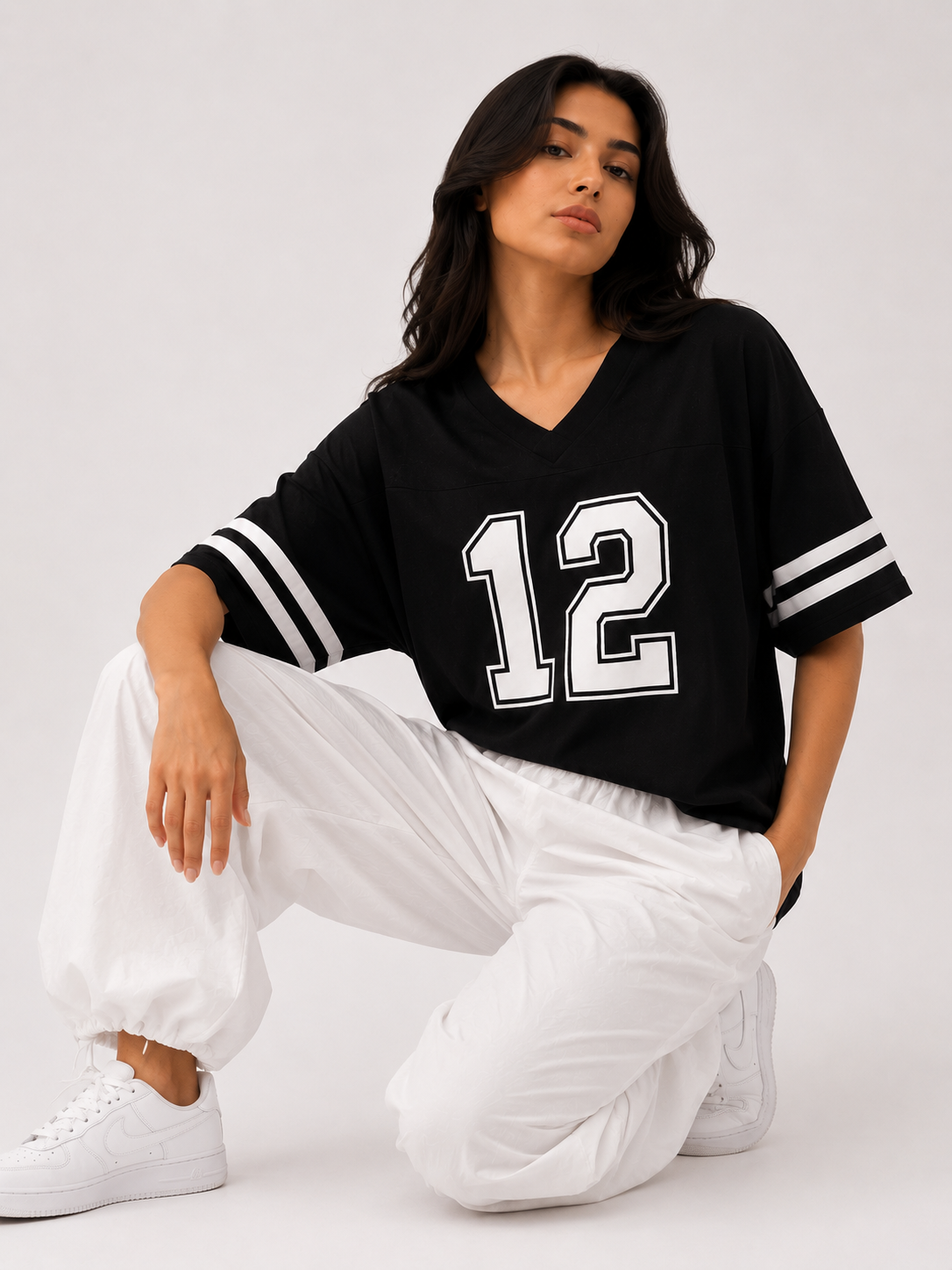 Oversized T-shirt with a print on the front bearing "the number 12", and on the back the phrase "We are 12".