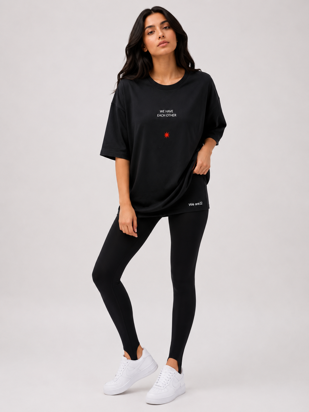 Oversized black t-shirt with the words "From Jordan to the World" and a red star on it.