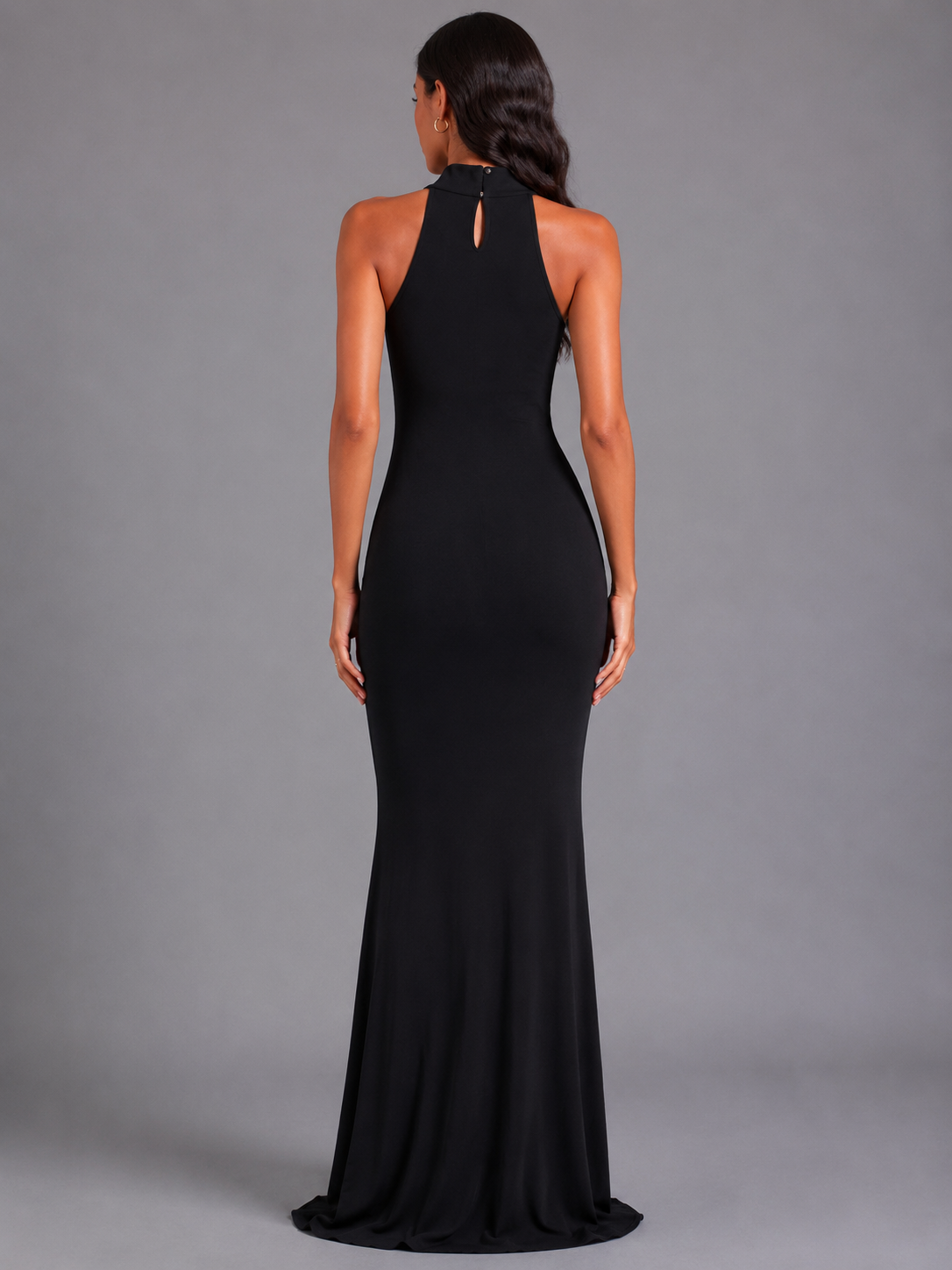 Long black halter-neck dress with rhinestones at the neckline.