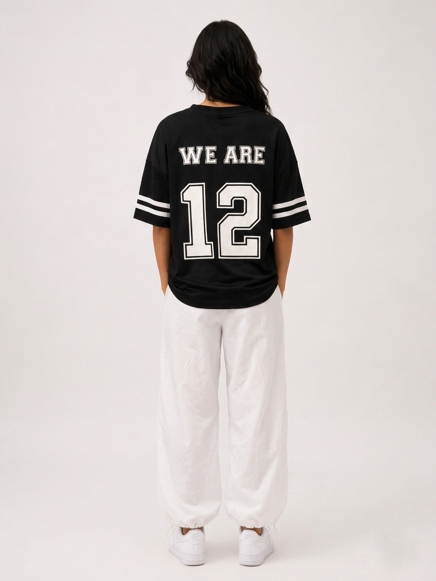 Oversized T-shirt with a print on the front bearing "the number 12", and on the back the phrase "We are 12".