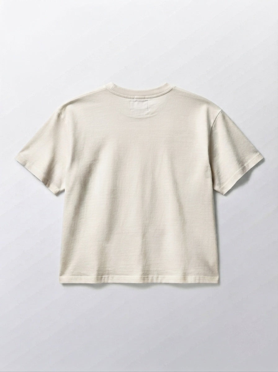 Oversized white T-shirt with "C'est la vie" written in red.