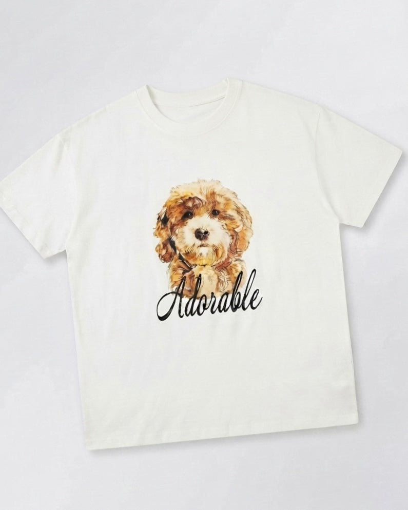 White oversized T-shirt featuring an "adorable" dog.
