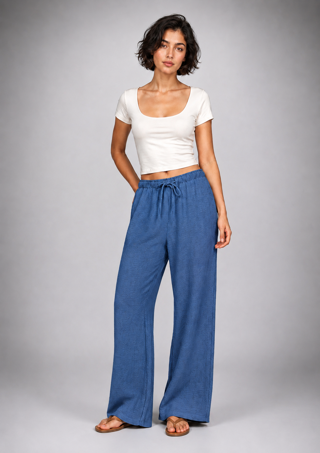 Straight-leg linen trousers with eyelet details