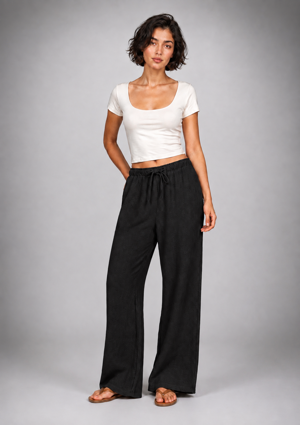 Straight-leg linen trousers with eyelet details