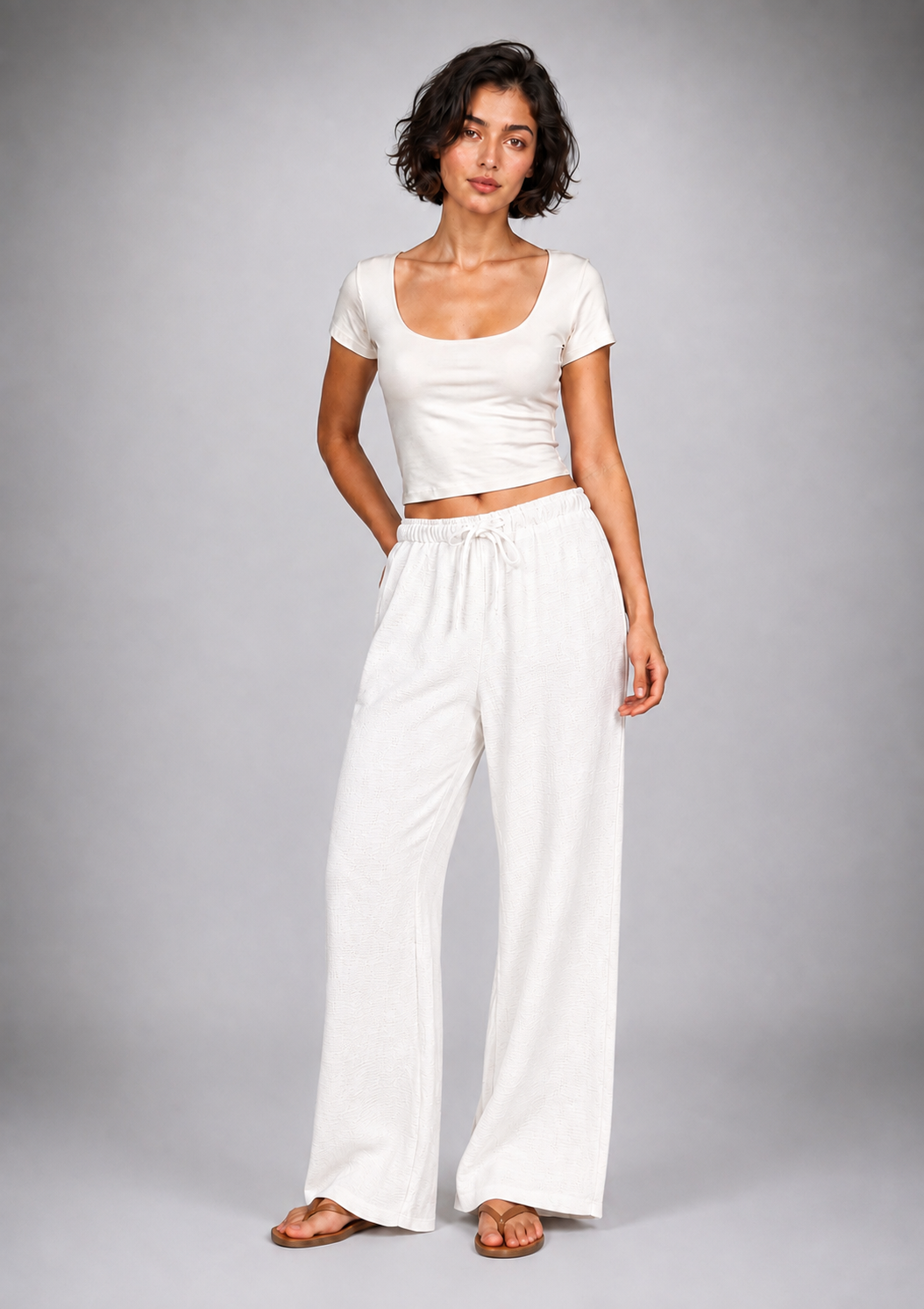 Straight-leg linen trousers with eyelet details