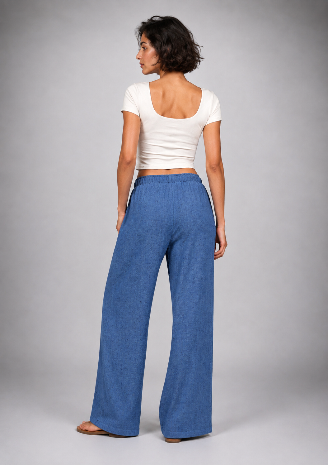 Straight-leg linen trousers with eyelet details