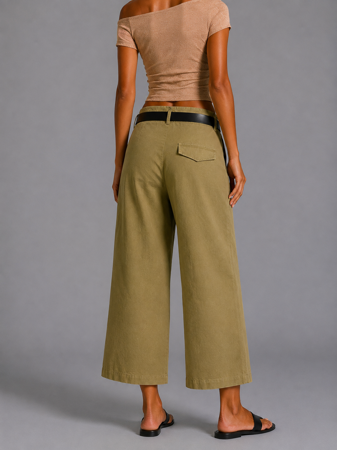Olive green straight-cut trousers with a black belt.