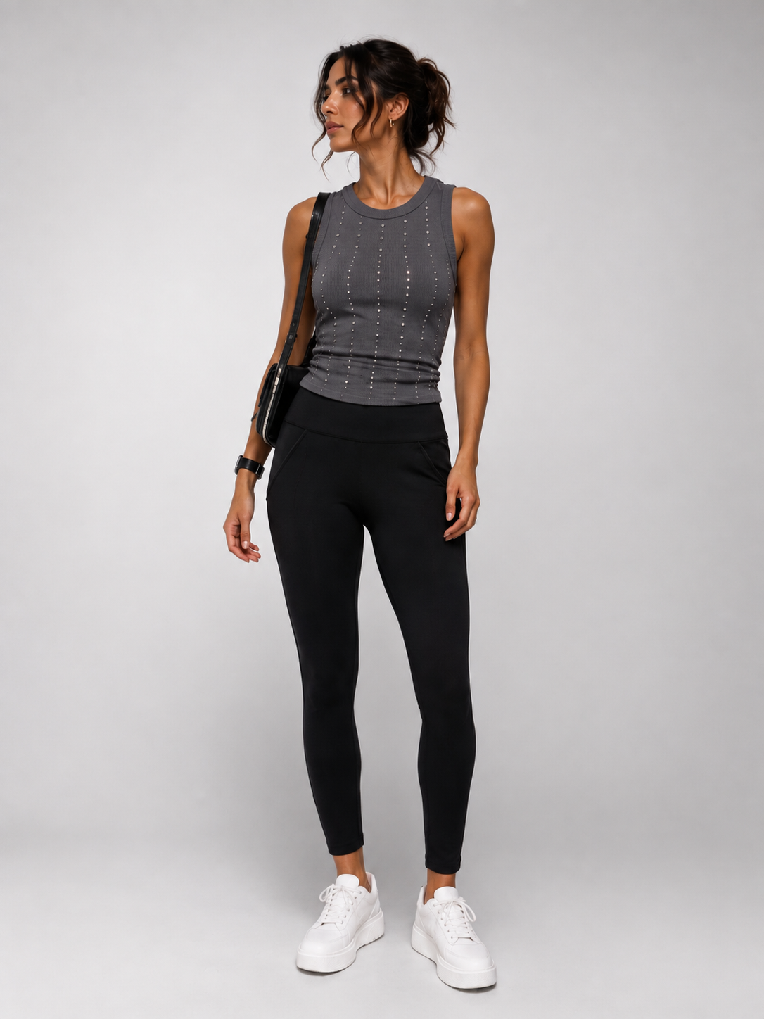 Black leggings with an elastic waist and two pockets.