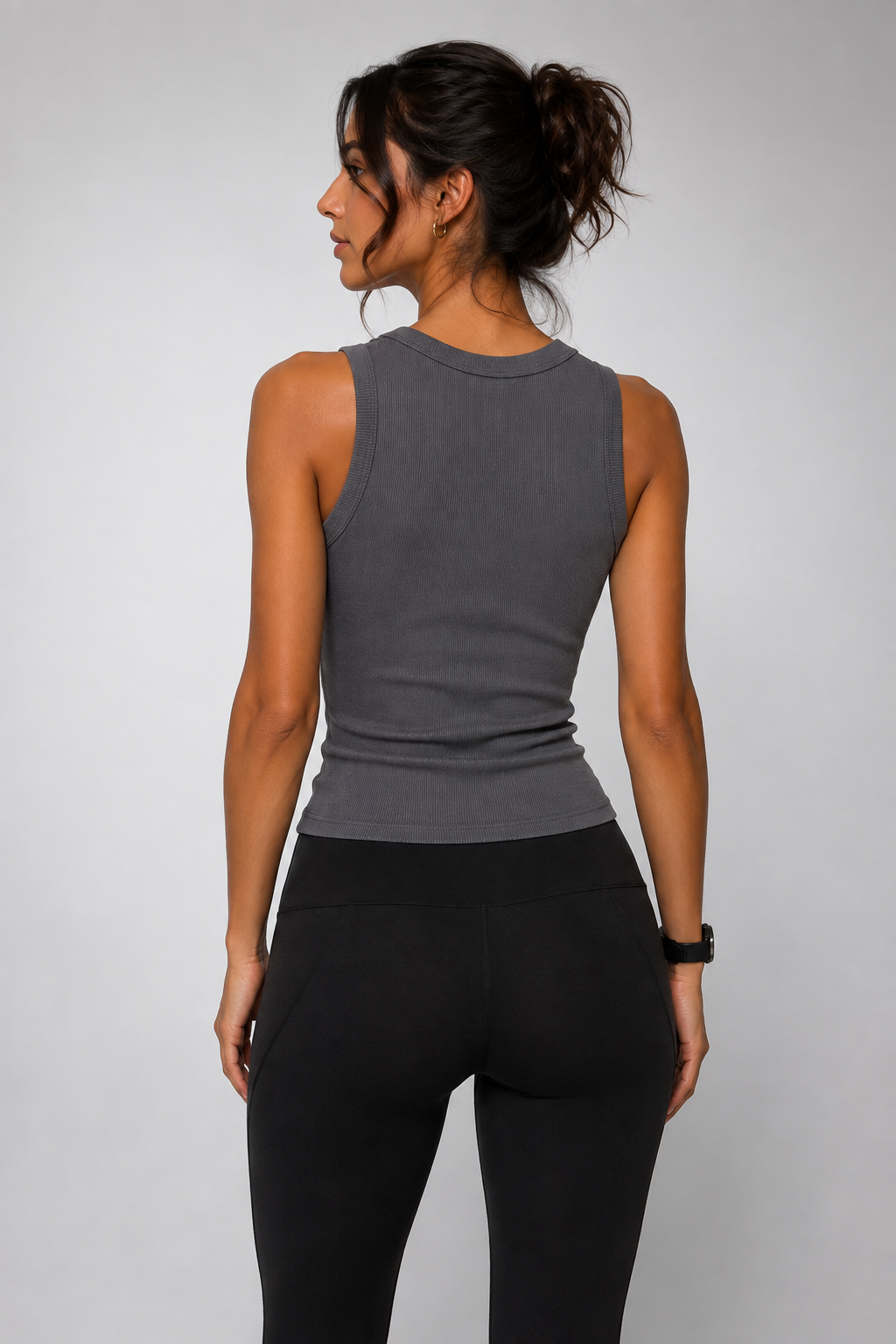 Sleeveless grey top with rhinestone embellishment.