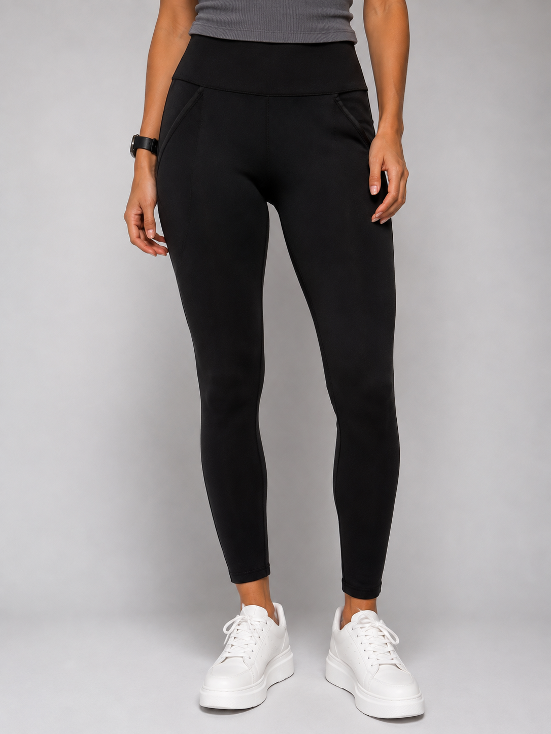 Black leggings with an elastic waist and two pockets.