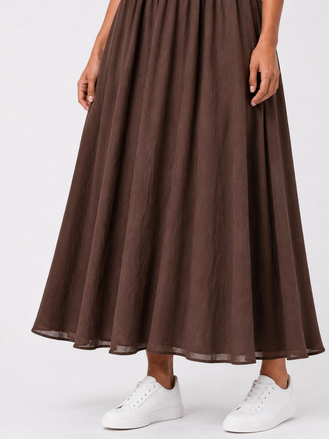 Long sleeveless dress with a button-front bodice.