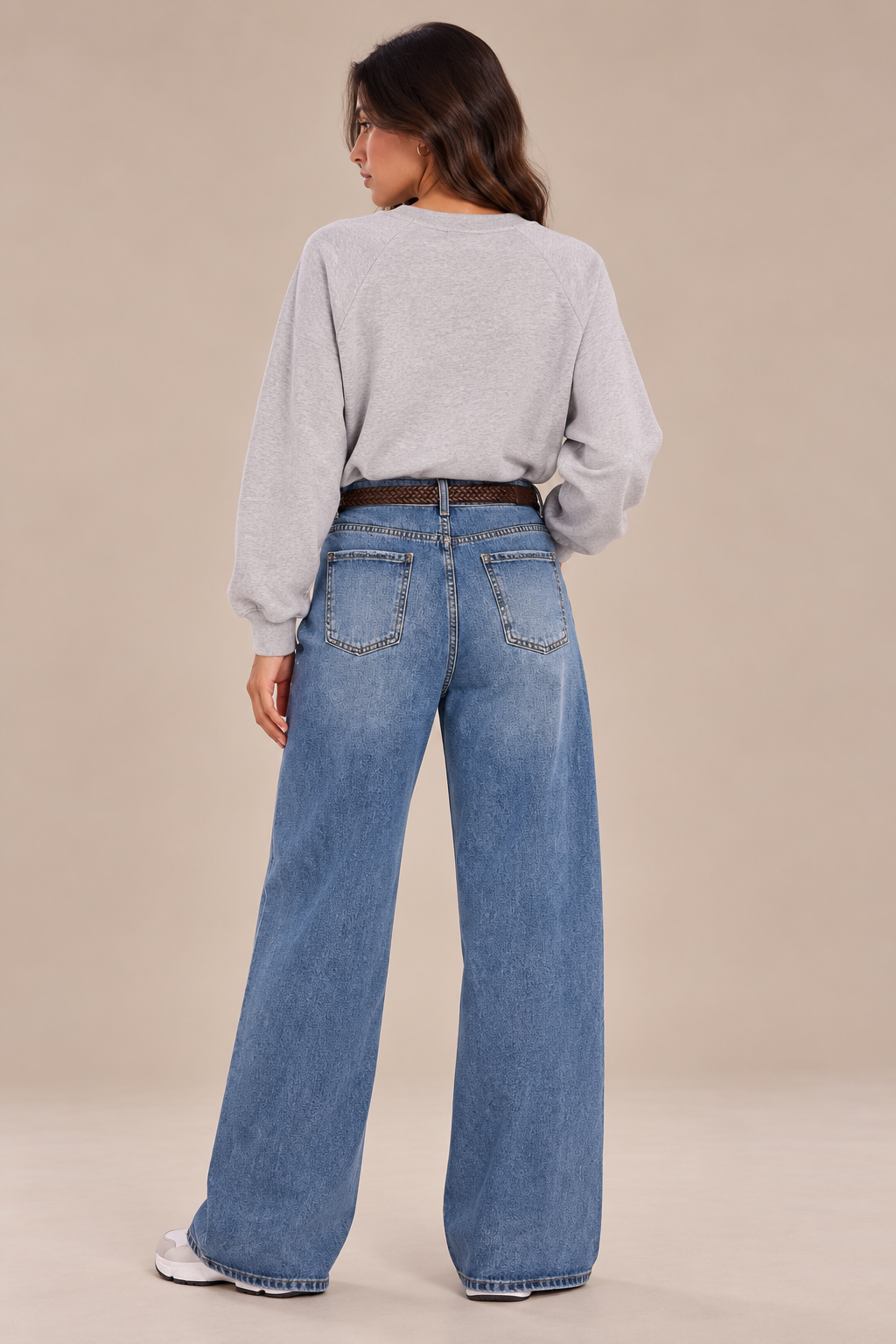 Straight-leg jeans with a brown belt and scarf