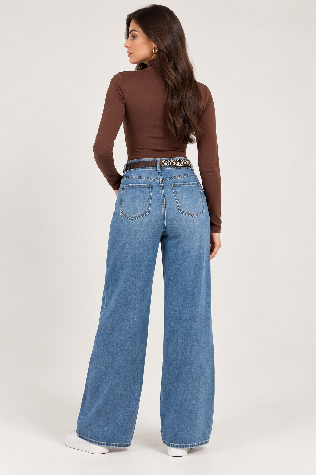 Wide leg dark blue jeans with a brown leather belt and scarf