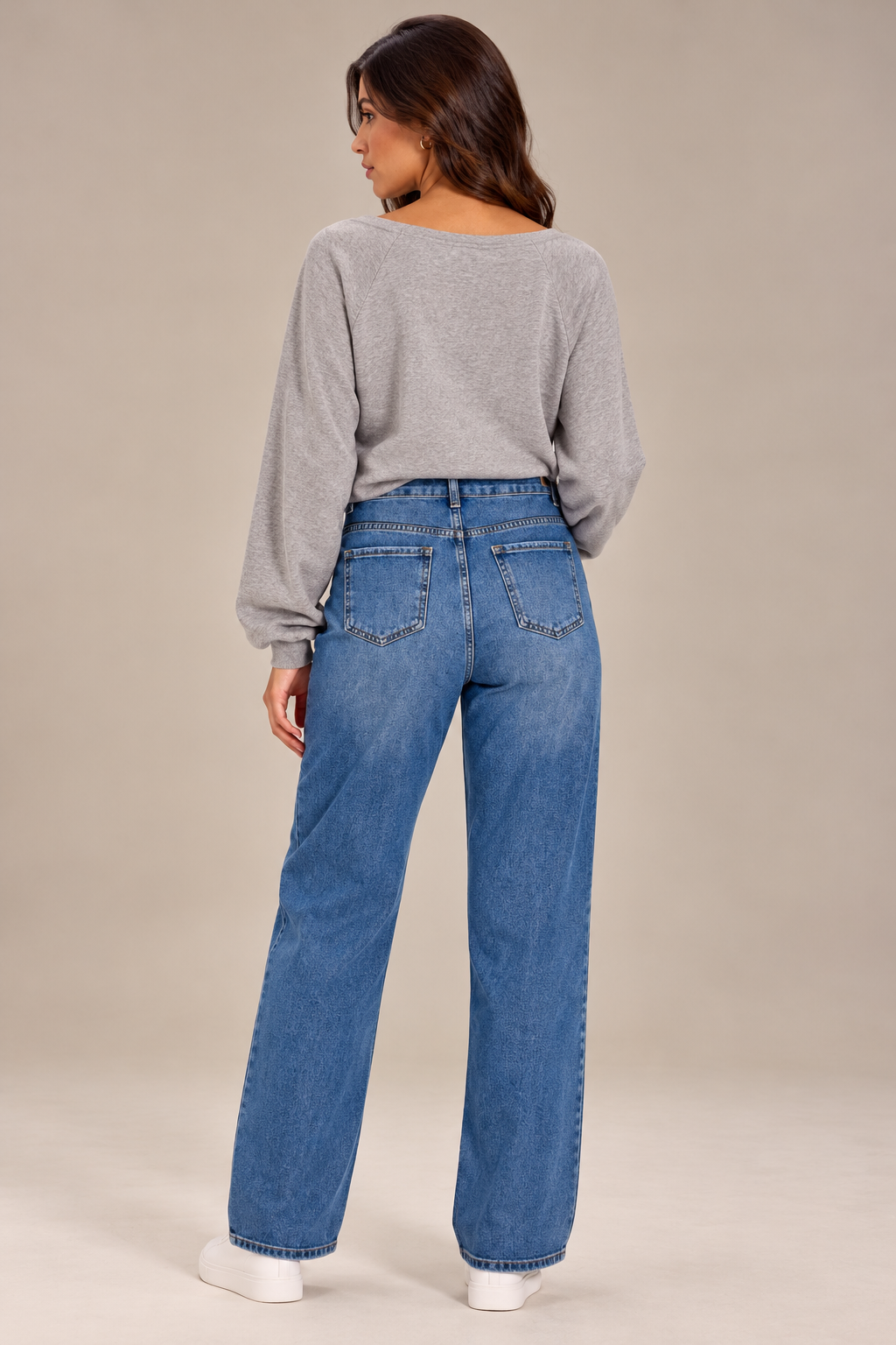 Straight-leg jeans with distressed details on the front.