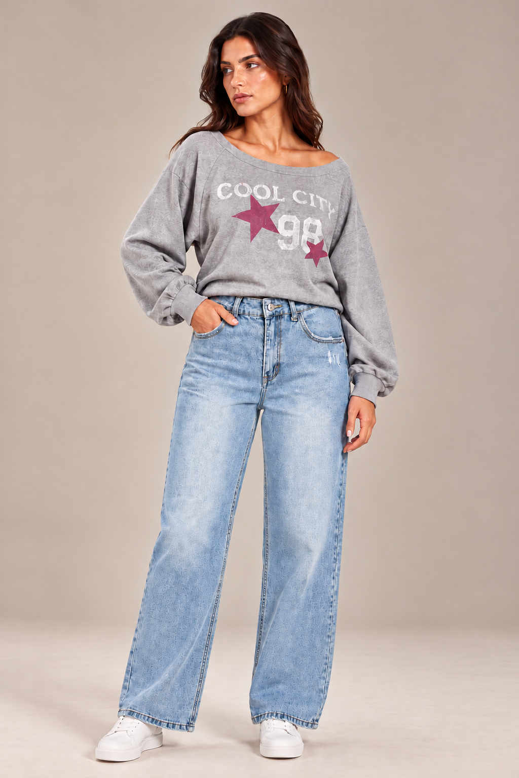 Straight-leg jeans with distressed details on the front.