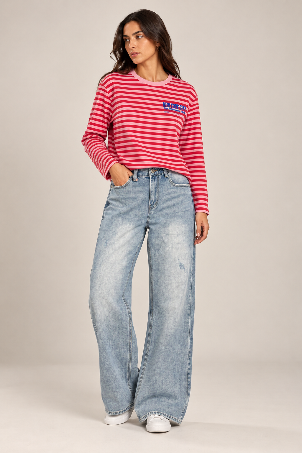 Wide-leg jeans featuring front distressing and distinctive back pockets.