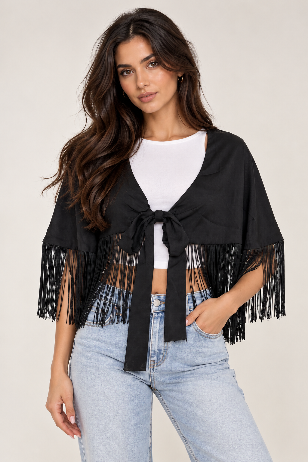 A satin shawl decorated with tassels on the shoulder and waist.