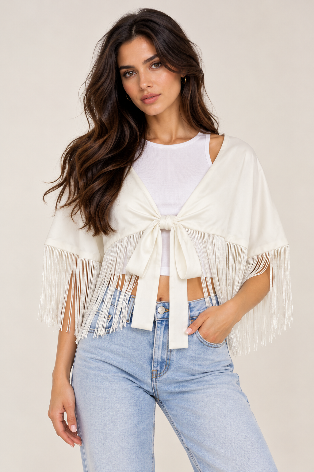 A satin shawl decorated with tassels on the shoulder and waist.