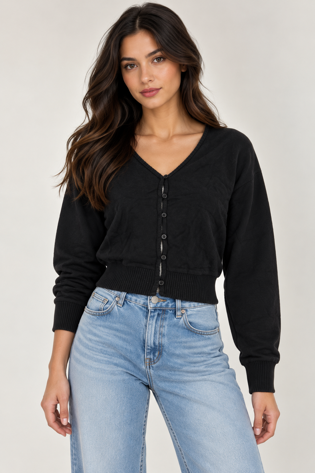 Wool cardigan with a V-neck and button closure.