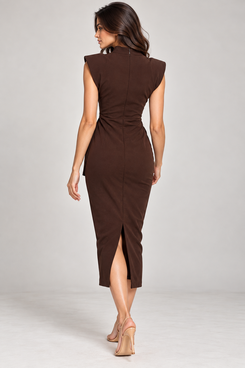 Long brown sleeveless dress with a tie waist