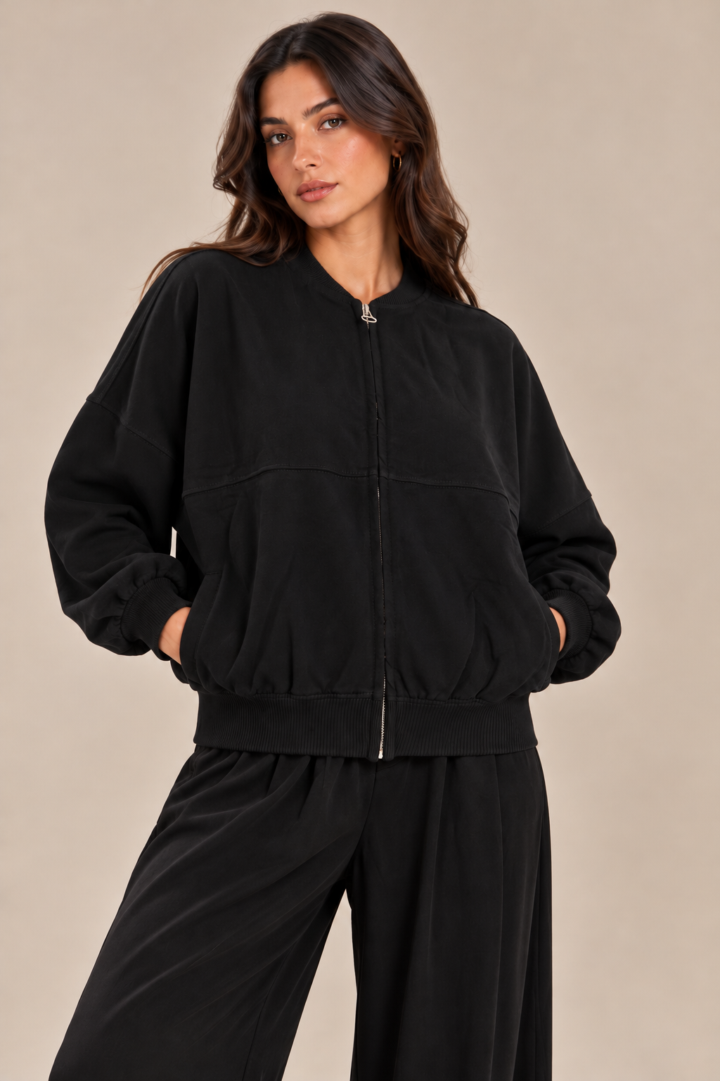 Oversized sweatshirt with a center front stripe, zip closure, and front pocket.