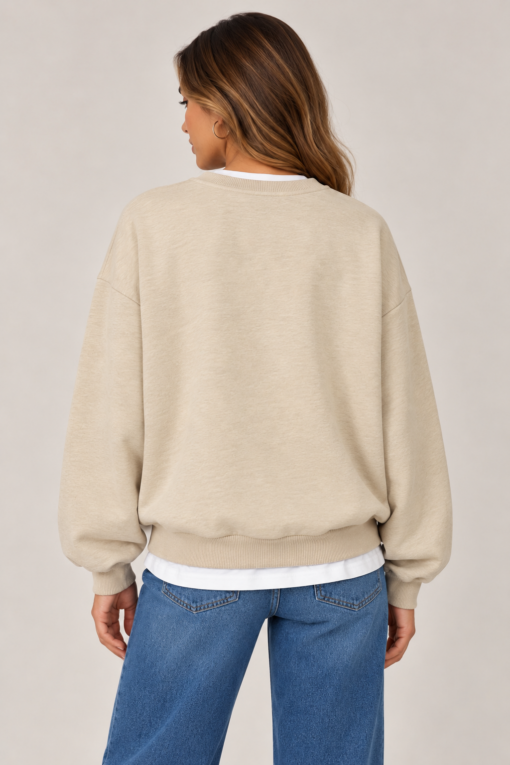 Oversized beige blouse with a white collar and waistband, and the word "CALIFORNIA" written on the chest in burgundy.