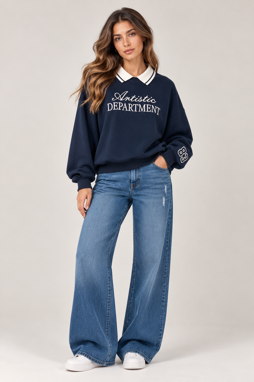Oversized navy blue blouse with a white shirt collar. "Artistic DEPARTMENT" written on the chest in white, and "83" on the sleeve.