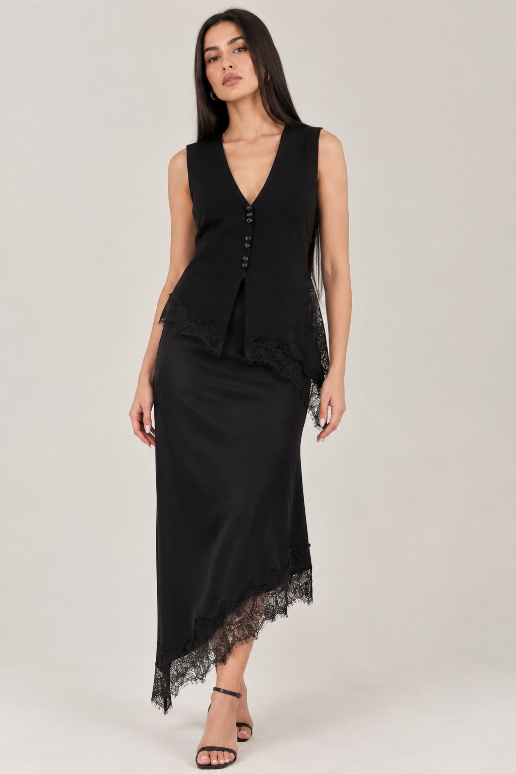 Black satin midi skirt with asymmetrical lace underneath