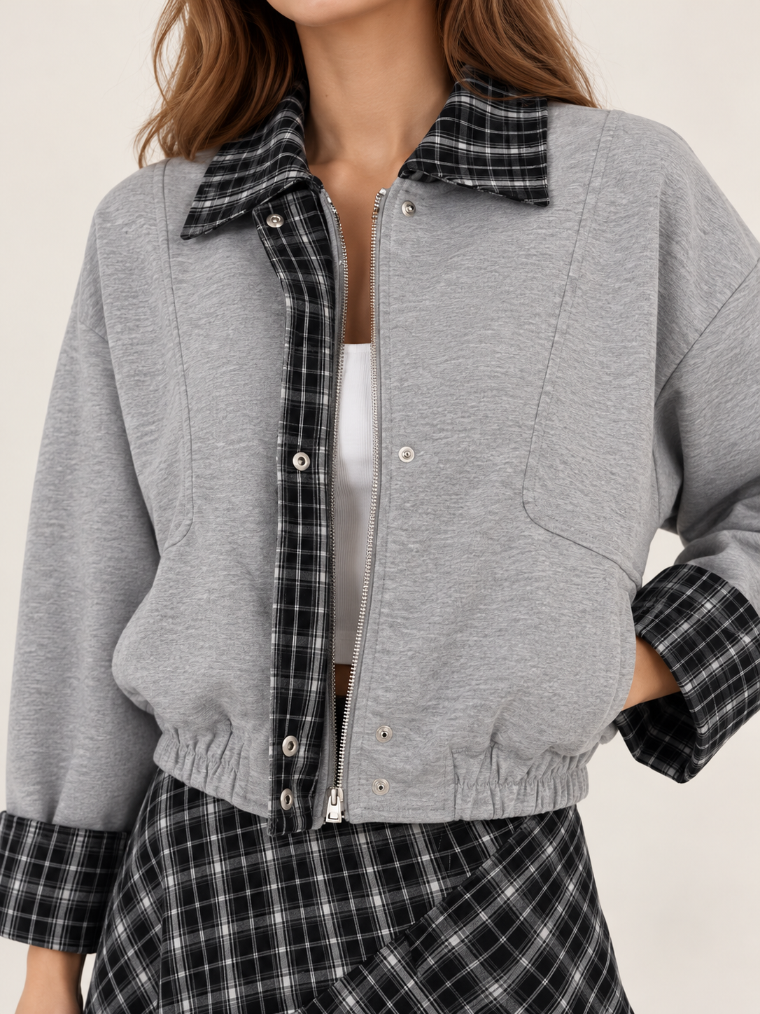 Gray jacket with a collar and sleeves, black and white checkered pattern.