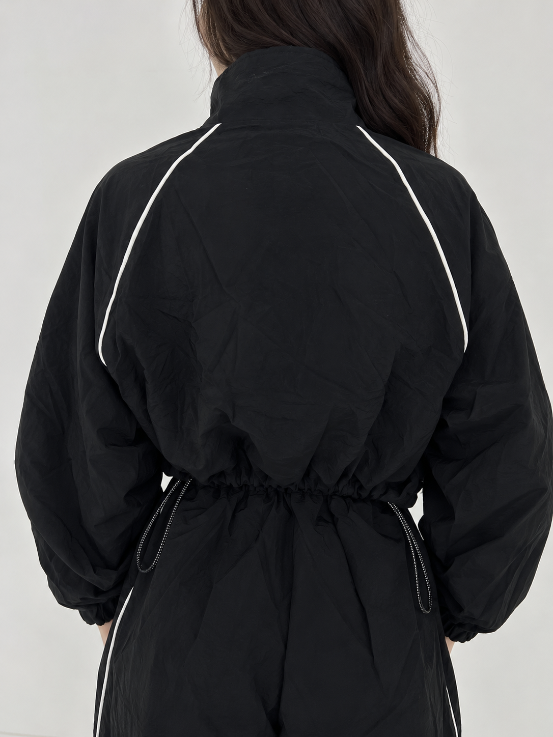 Black waterproof sweatshirt with white stripe and front pocket