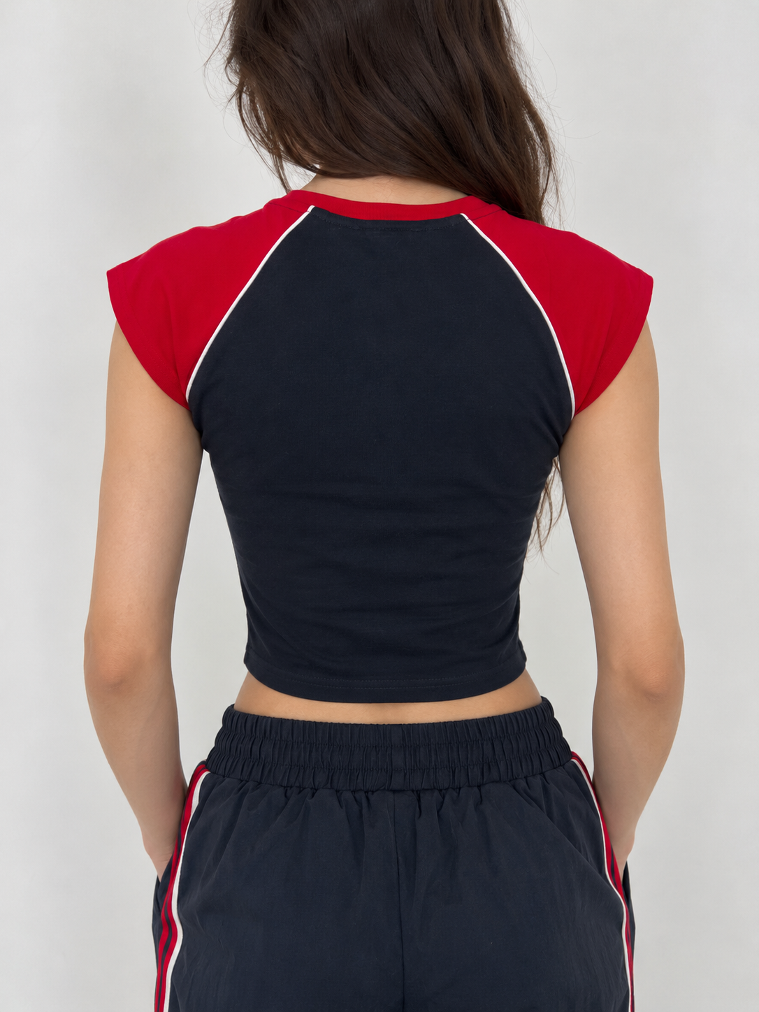 Navy blue t-shirt with red shoulders and the word "LOS ANGELES" on the chest.