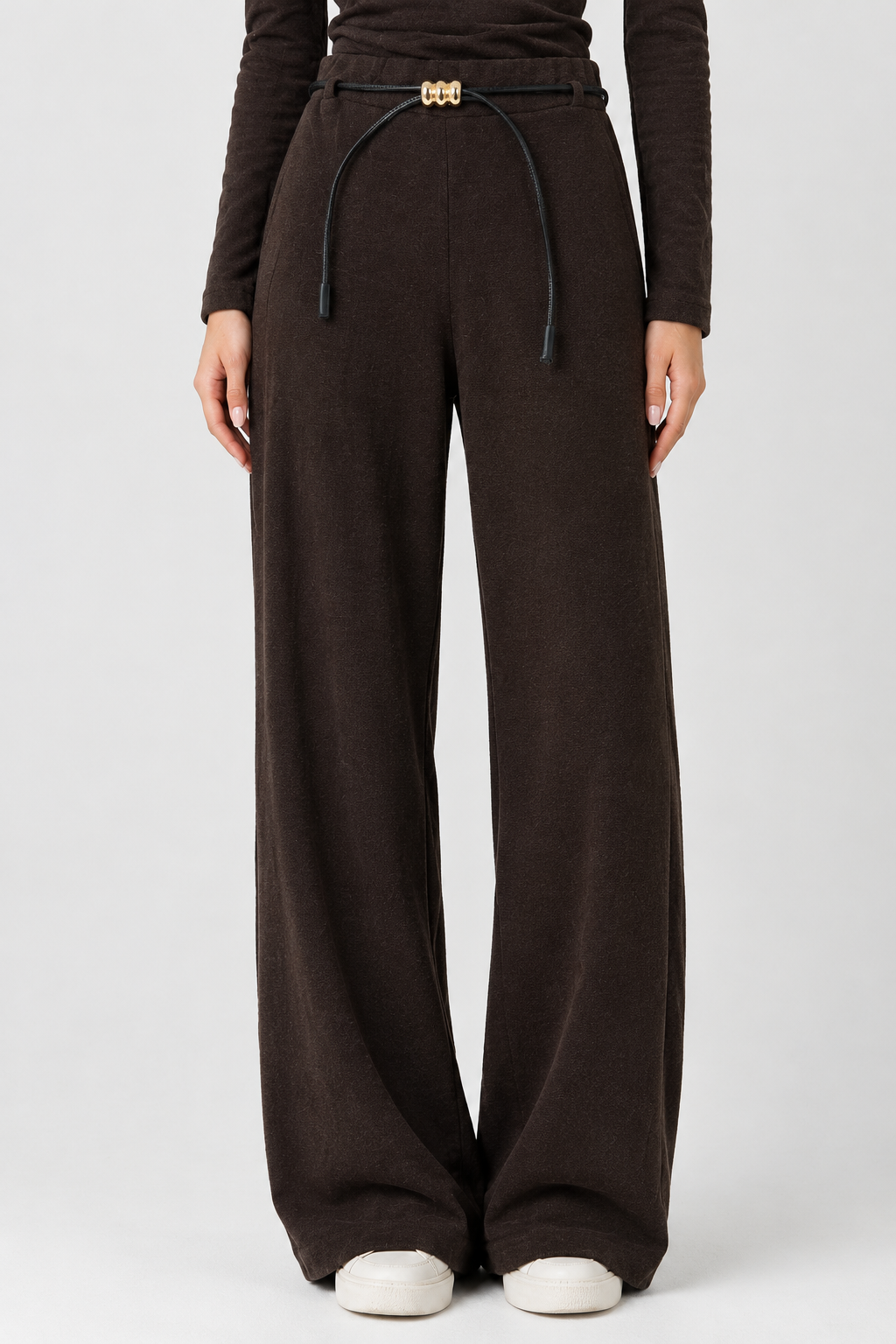 Chocolate brown wool straight-cut trousers with a black belt and gold buckle.
