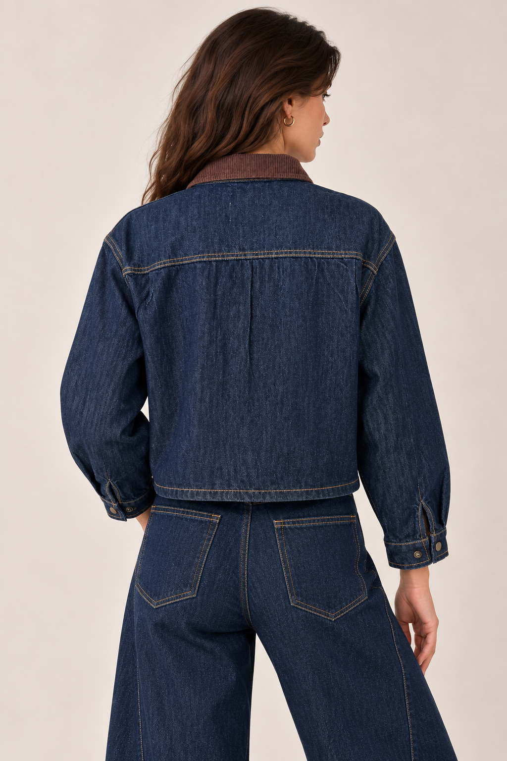 Navy denim jacket with a brown suede collar