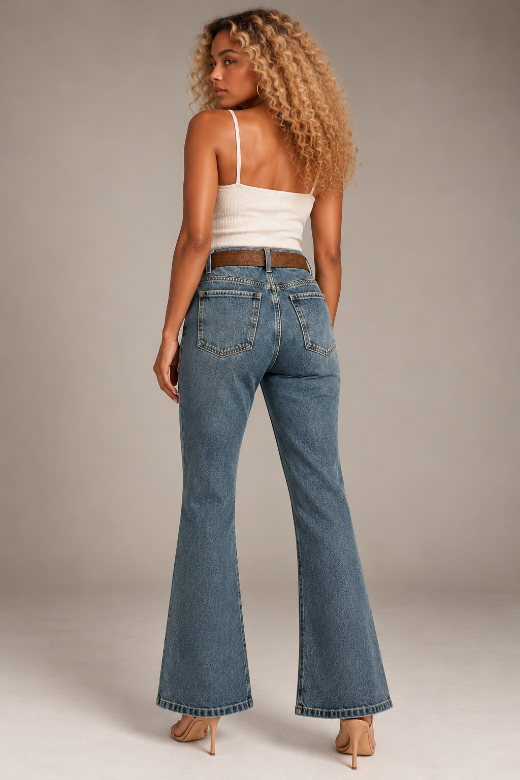 Light dusty blue jeans with a honey-colored belt pattern
