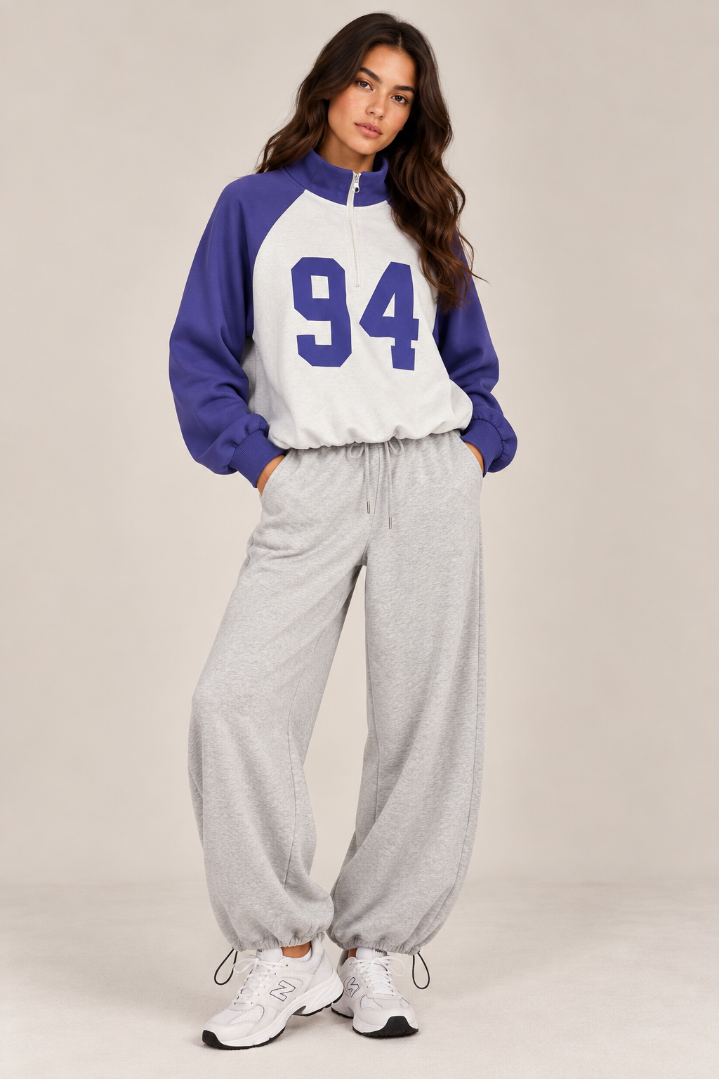 Sweater with a zippered collar, colored sleeves, and a white chest with the number "94"