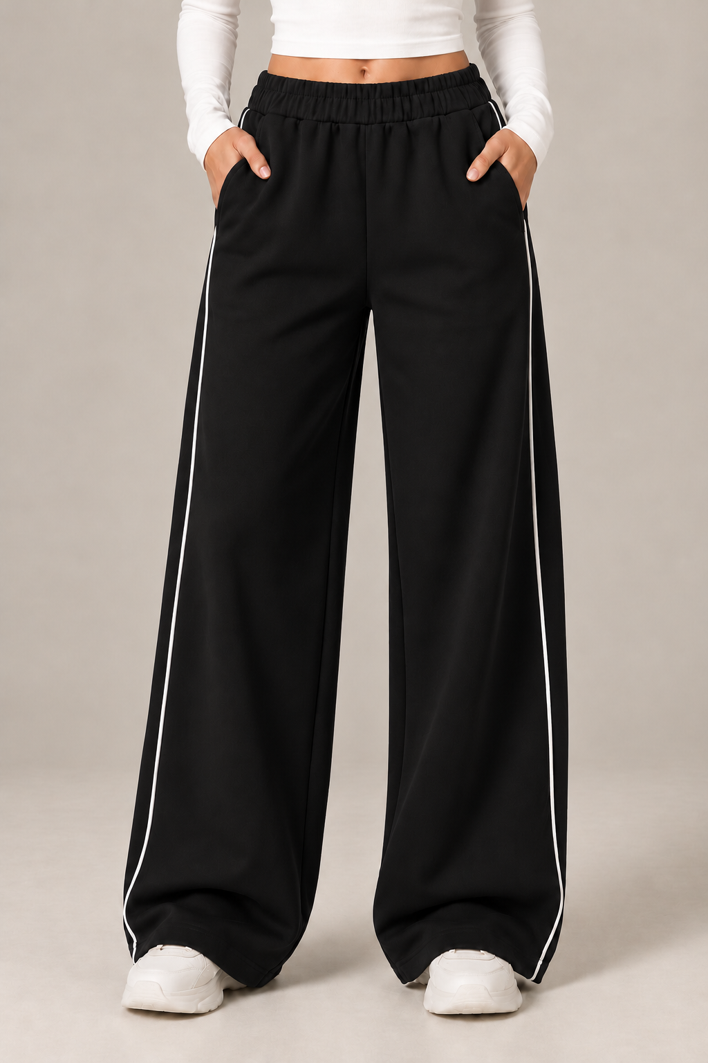 Wide leg sweatpants with a white stripe down the sides and an elastic waistband.