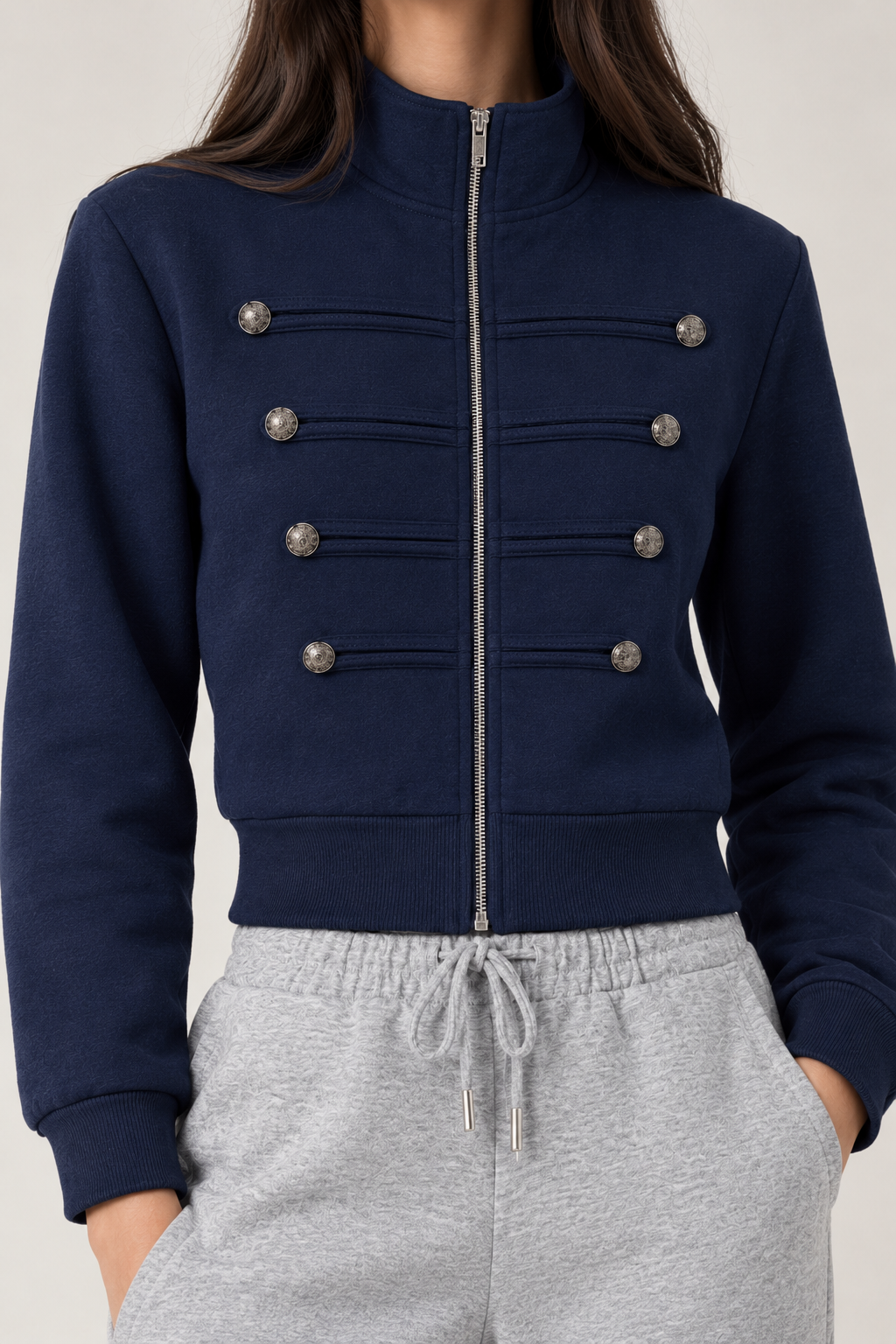 Chinese-style sweatshirt with silver buttons and a zippered front.