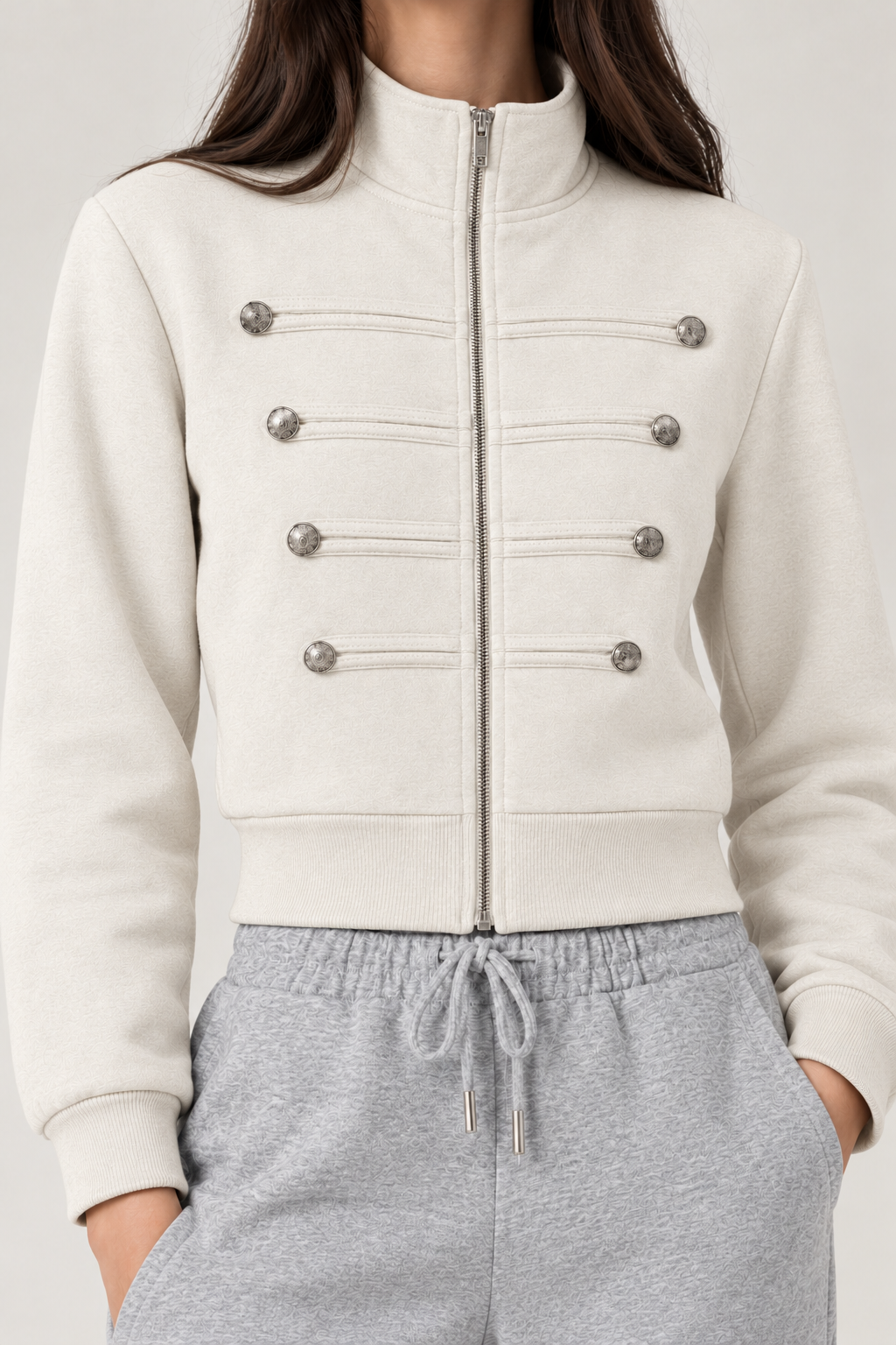 Chinese-style sweatshirt with silver buttons and a zippered front.