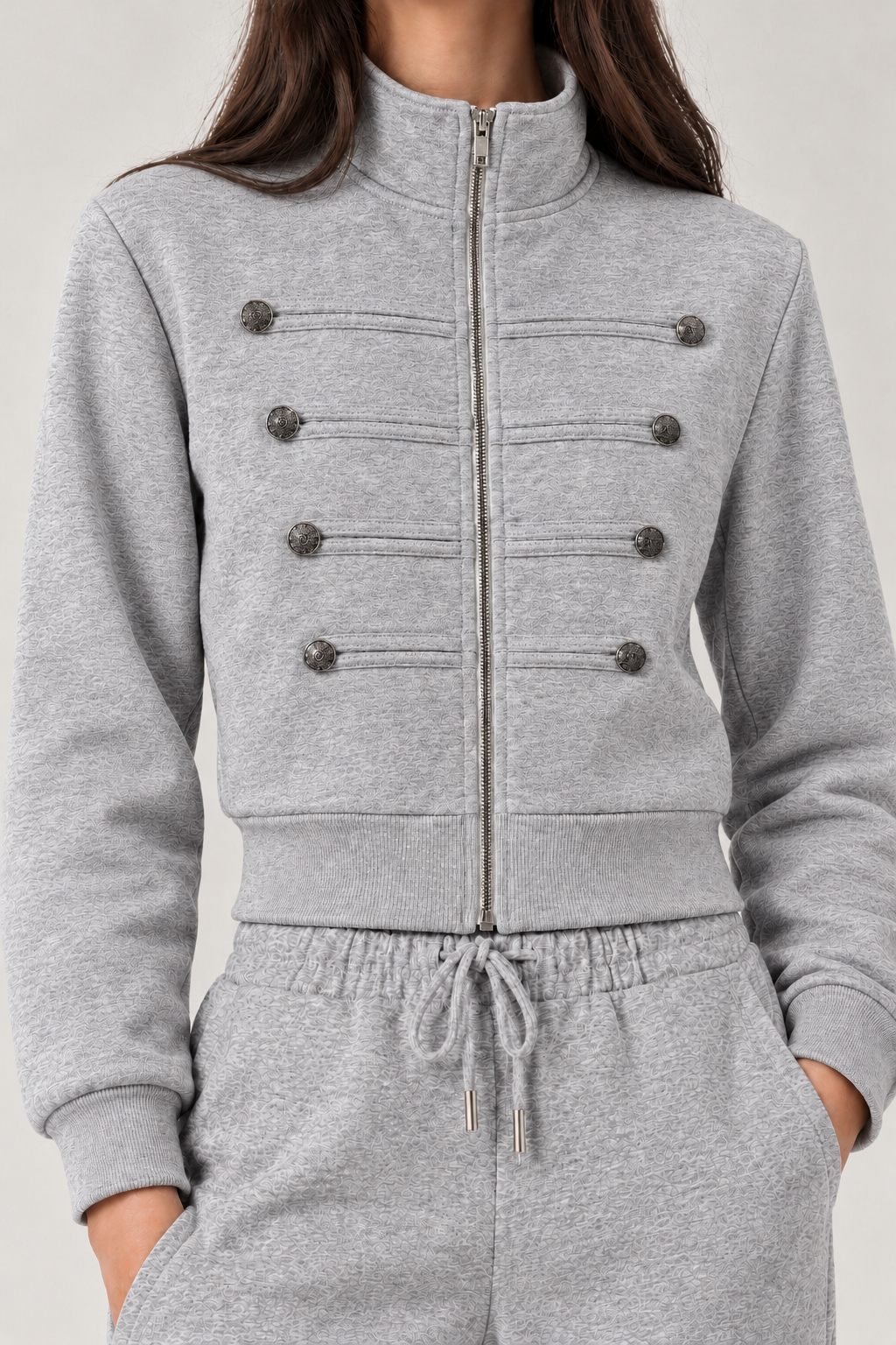 Chinese-style sweatshirt with silver buttons and a zippered front.