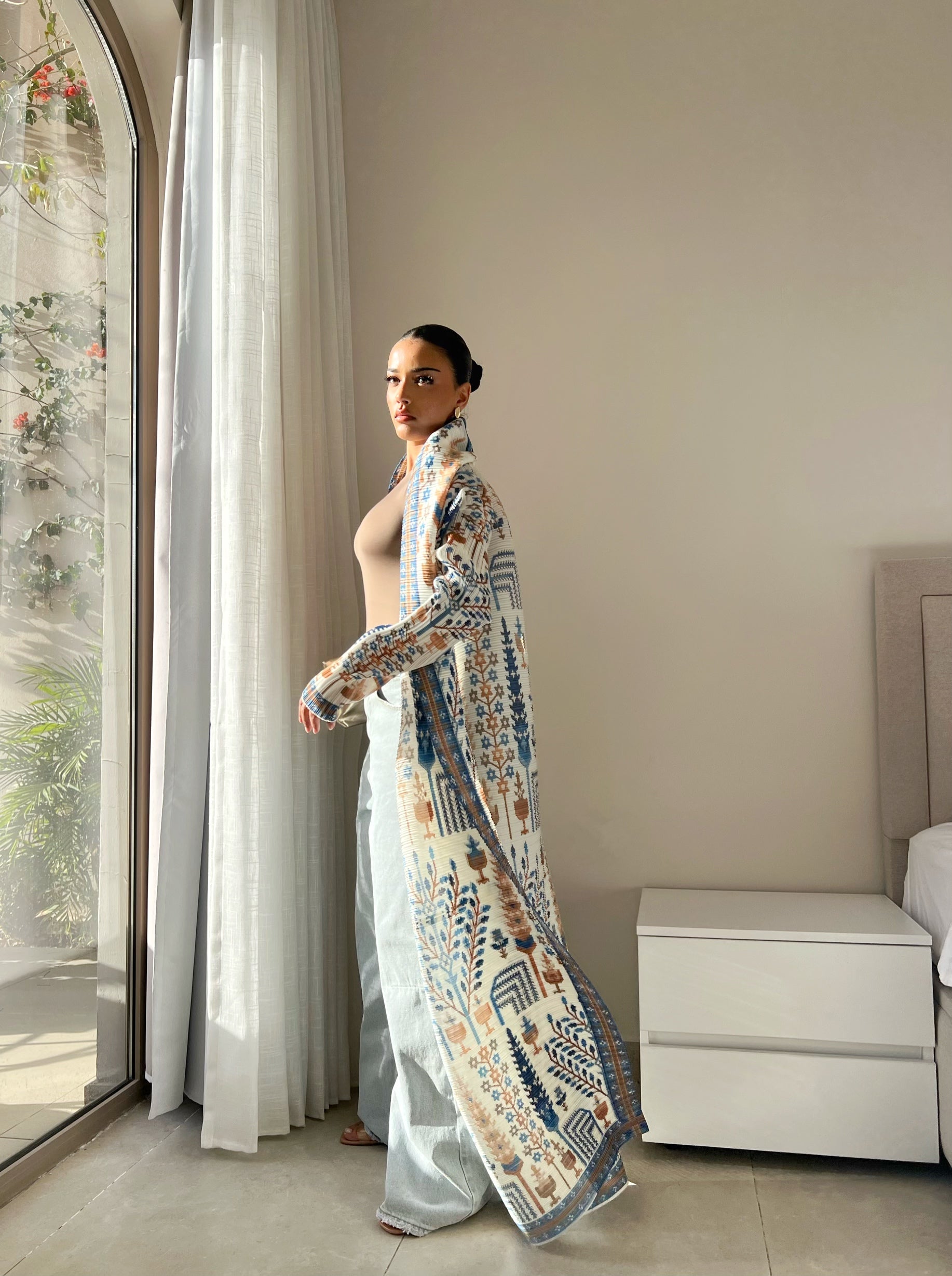 Blue and brown patterned abaya with a tied waist
